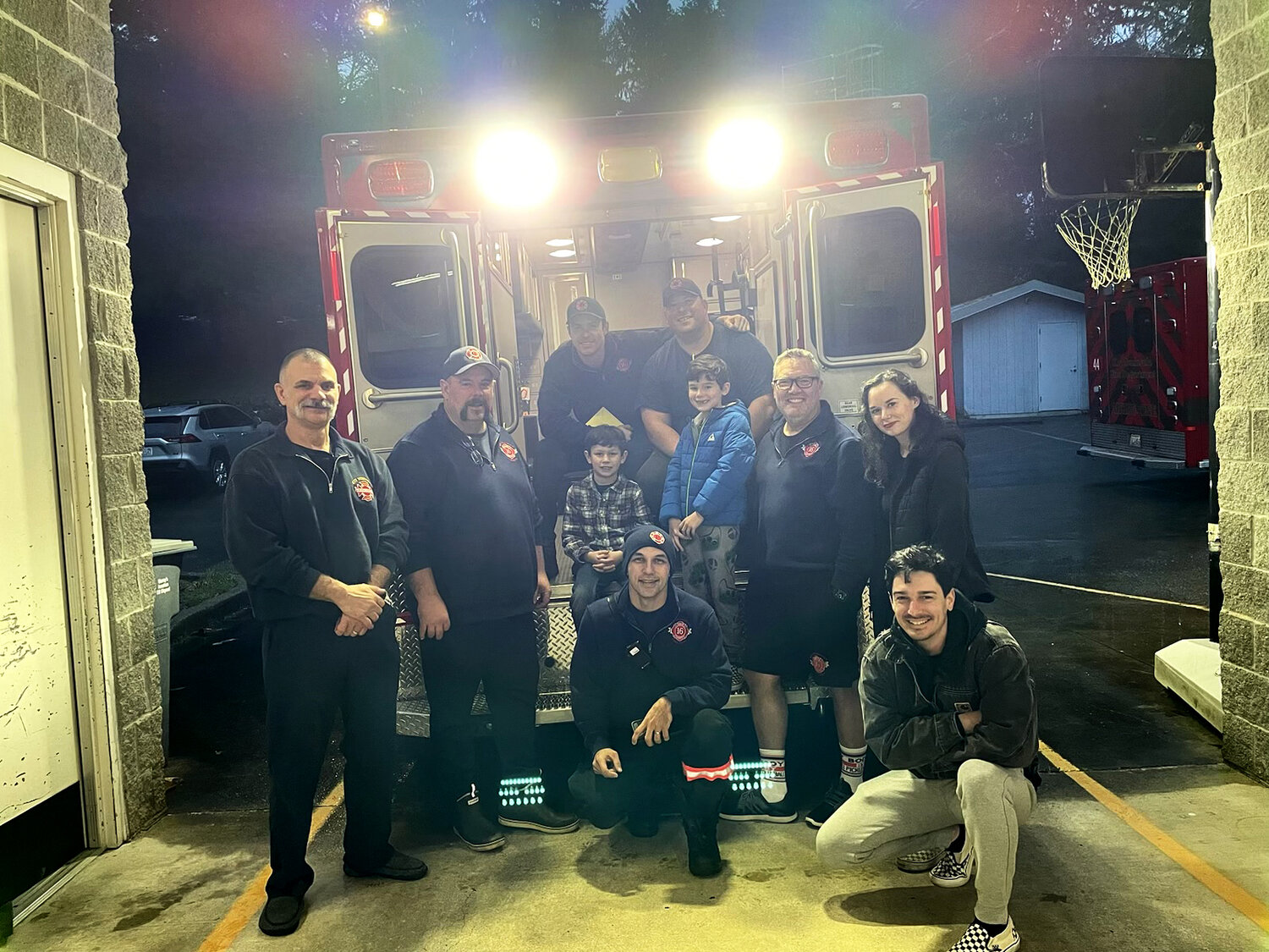 Greyson and family with his first responders on Christmas Day.